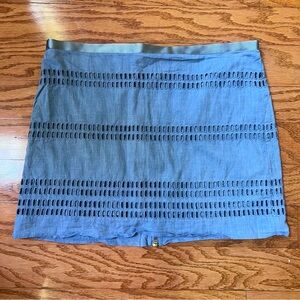 Gap size 4 chambray mini skirt with cutout design and zipper down the back.